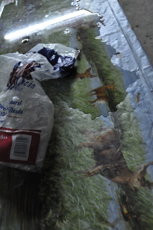 Leaving an ice bag to melt over the table.