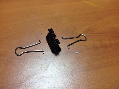 Disassemble a paper / document clip.