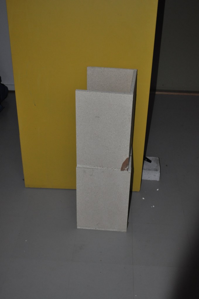 Picking up two wooden boxes from the trash1